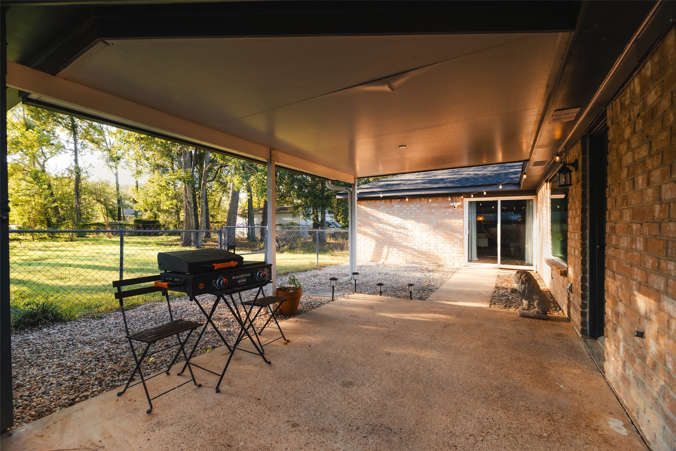 419 Magnolia Bend New Caney, TX 77357 - Photo 22 of 25 a backyard of a house with table and chairs
