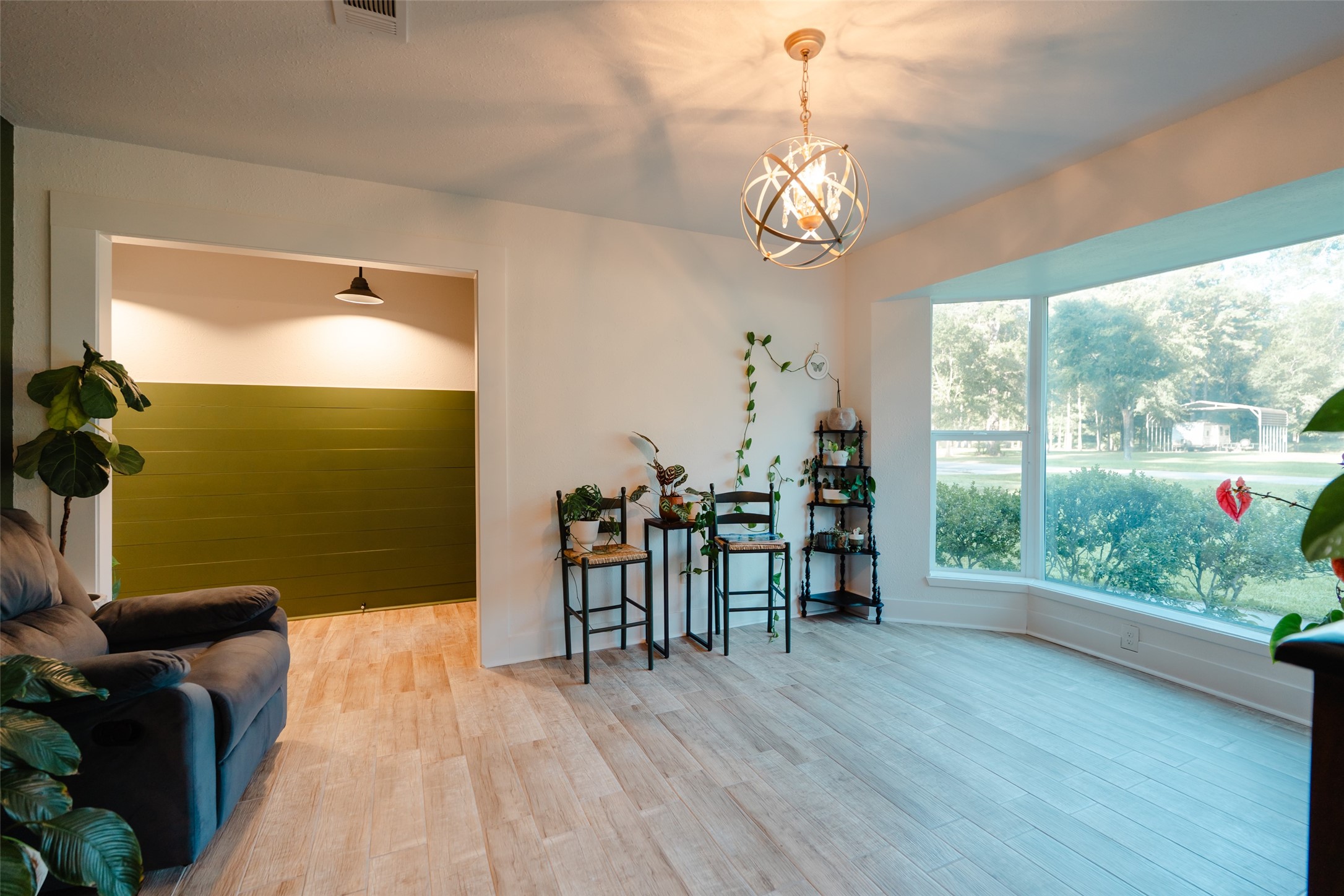 419 Magnolia Bend New Caney, TX 77357 - Photo 3 of 25 a view of a dining room with furniture window and wooden floor
