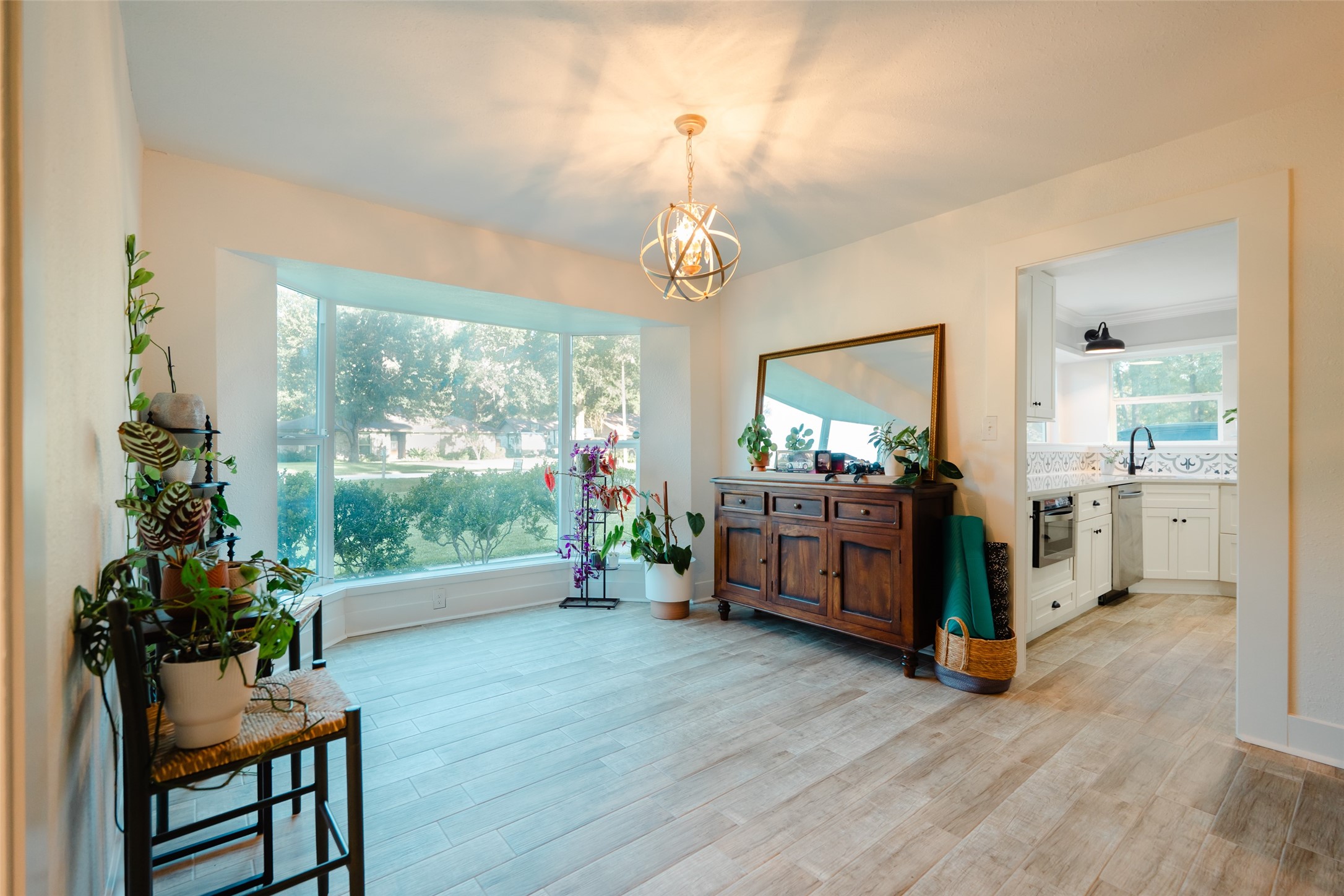 419 Magnolia Bend New Caney, TX 77357 - Photo 5 of 25 a living room with furniture and a chandelier