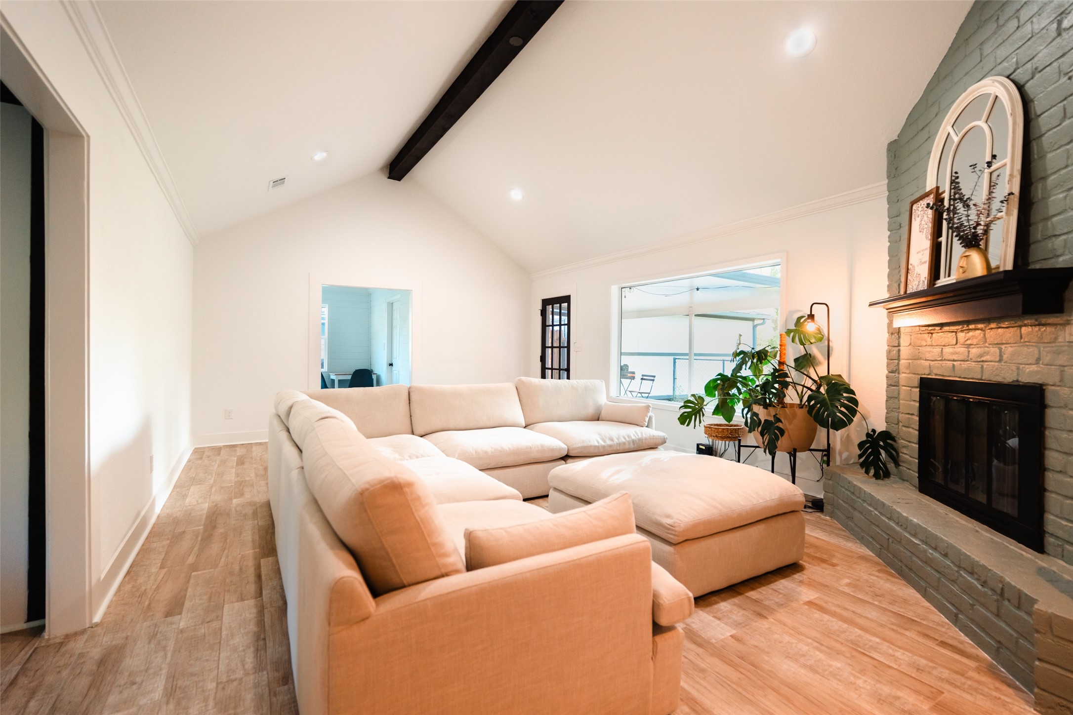 419 Magnolia Bend New Caney, TX 77357 - Photo 9 of 25 a living room with furniture fireplace and a large window