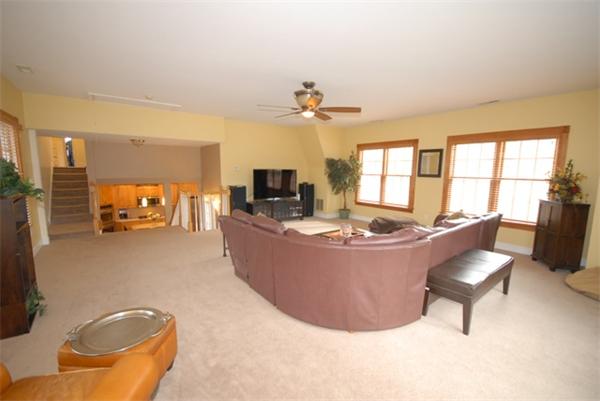 43 Bartlet Street Andover, MA 01810 - Photo 12 of 30 a living room with furniture and a flat screen tv