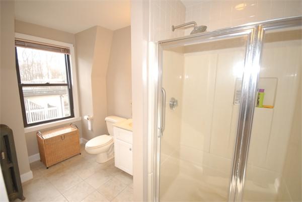 43 Bartlet Street Andover, MA 01810 - Photo 16 of 30 a bathroom with a granite countertop sink toilet and shower