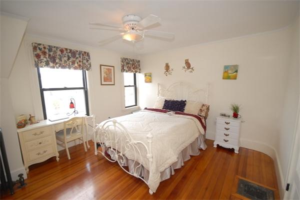 43 Bartlet Street Andover, MA 01810 - Photo 17 of 30 a bedroom with a bed and a window