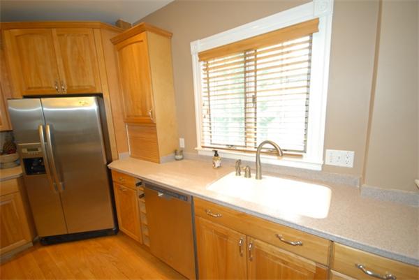 43 Bartlet Street Andover, MA 01810 - Photo 2 of 30 a kitchen with stainless steel appliances a sink and a refrigerator
