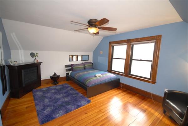 43 Bartlet Street Andover, MA 01810 - Photo 21 of 30 a bedroom with natural light and wooden floor