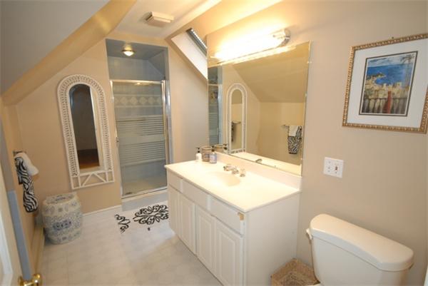 43 Bartlet Street Andover, MA 01810 - Photo 24 of 30 a bathroom with a sink a toilet and mirror