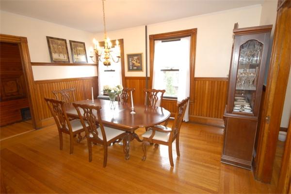 43 Bartlet Street Andover, MA 01810 - Photo 8 of 30 a dining room with furniture a chandelier and wooden floor