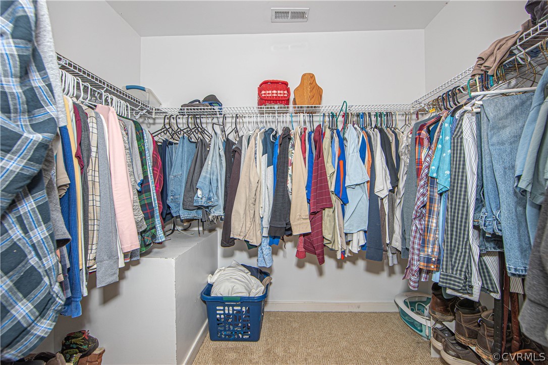 24410 Johnson Road Jetersville, VA 23083 - Photo 15 of 47 a view of walk in closet with clothes