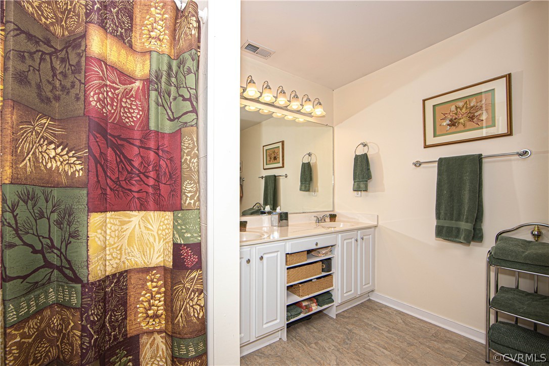 24410 Johnson Road Jetersville, VA 23083 - Photo 16 of 47 a view of a bathroom with sink and mirror