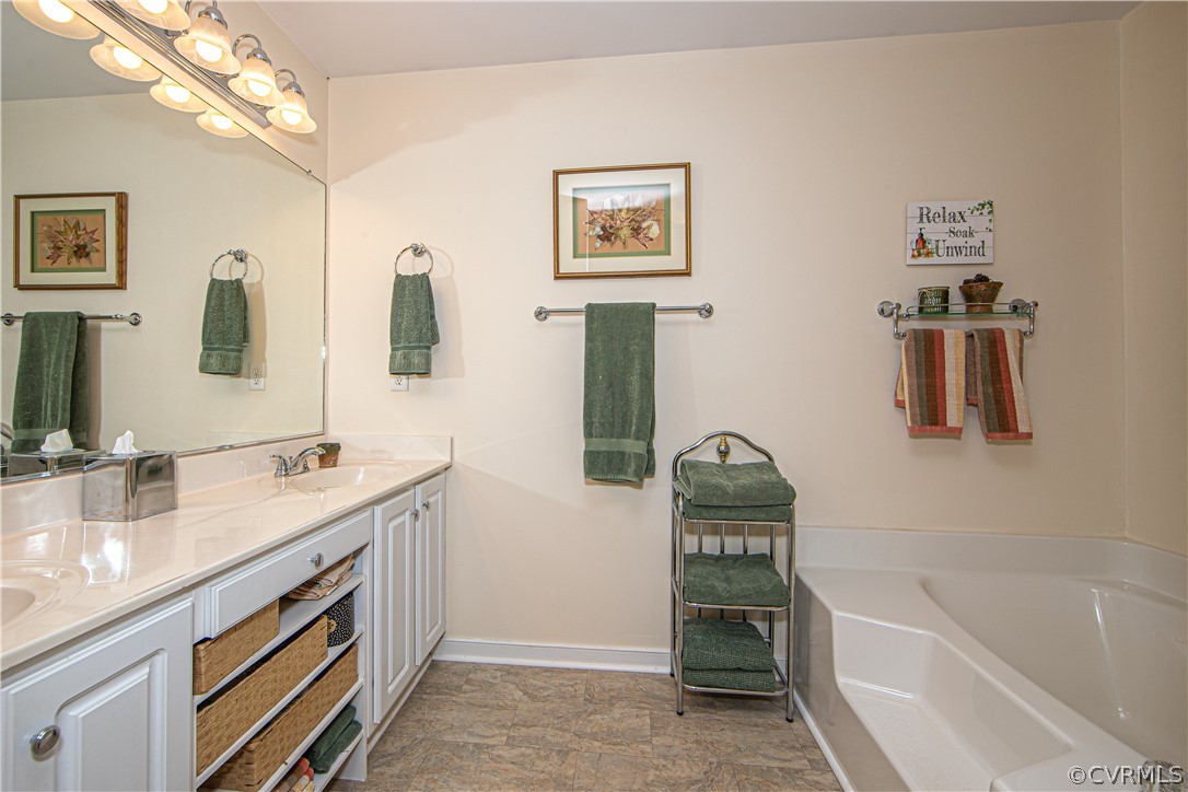 24410 Johnson Road Jetersville, VA 23083 - Photo 17 of 47 a bathroom with a sink a toilet and bathtub
