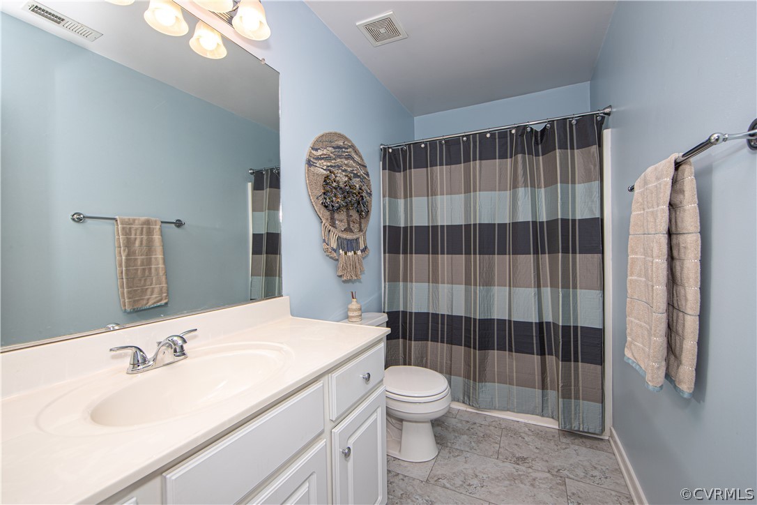 24410 Johnson Road Jetersville, VA 23083 - Photo 21 of 47 a bathroom with a sink toilet and shower