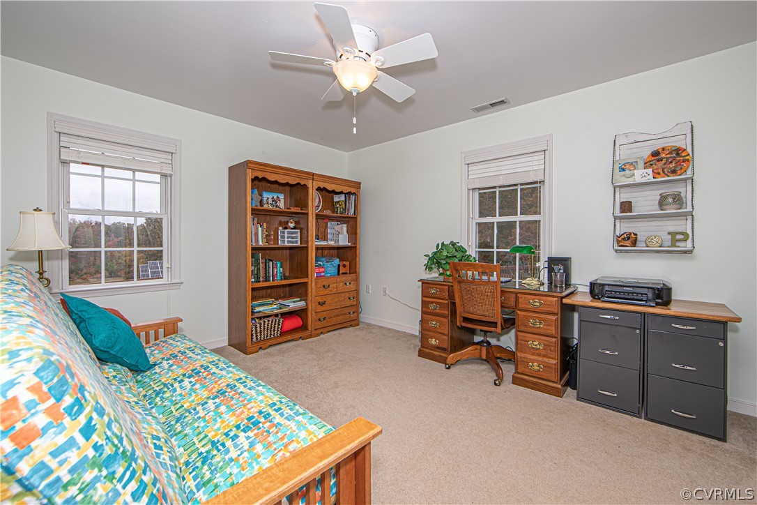 24410 Johnson Road Jetersville, VA 23083 - Photo 22 of 47 a view of a workspace with furniture and a window