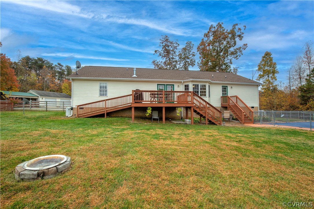 24410 Johnson Road Jetersville, VA 23083 - Photo 25 of 47 a view of a house with a backyard porch and furniture