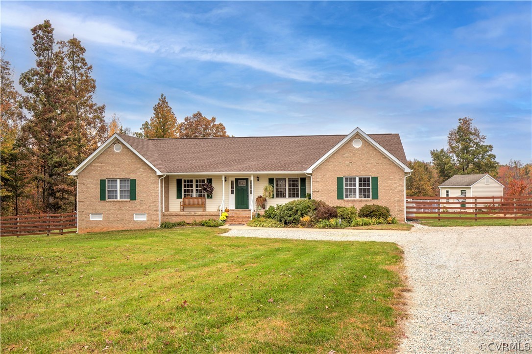 24410 Johnson Road Jetersville, VA 23083 - Photo 3 of 47 a front view of a house with a yard