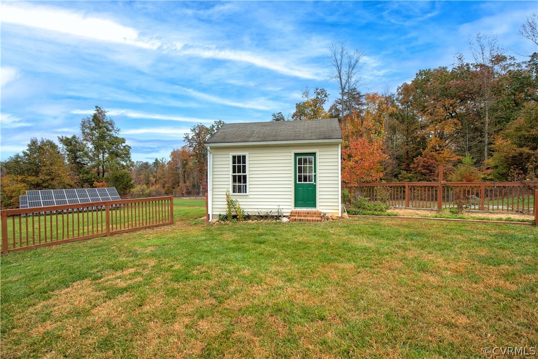 24410 Johnson Road Jetersville, VA 23083 - Photo 32 of 47 a view of a backyard with a small cabin