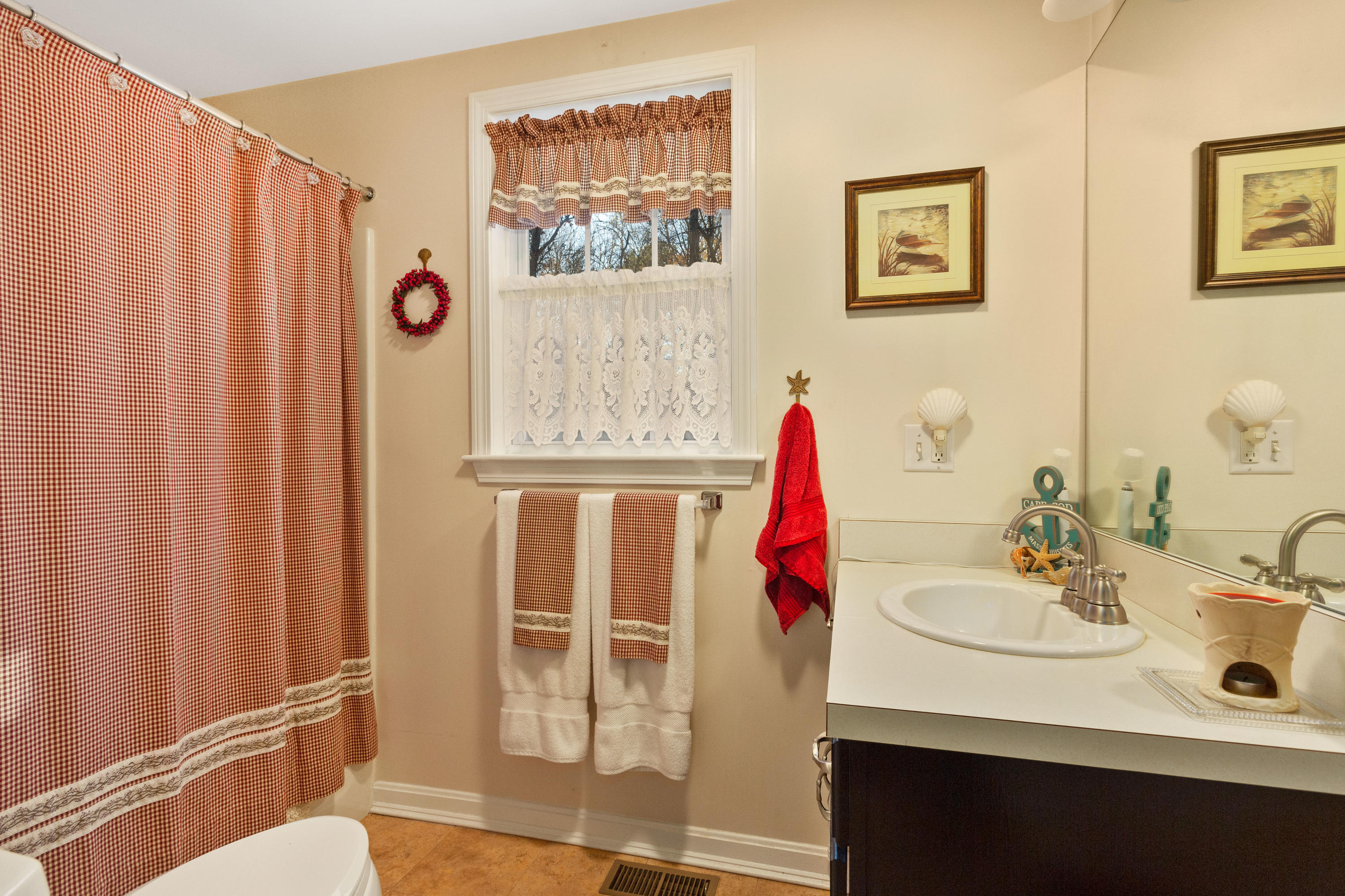 70 South Precinct Road Centerville, MA 02632 - Photo 14 of 32 a bathroom with a sink and a mirror