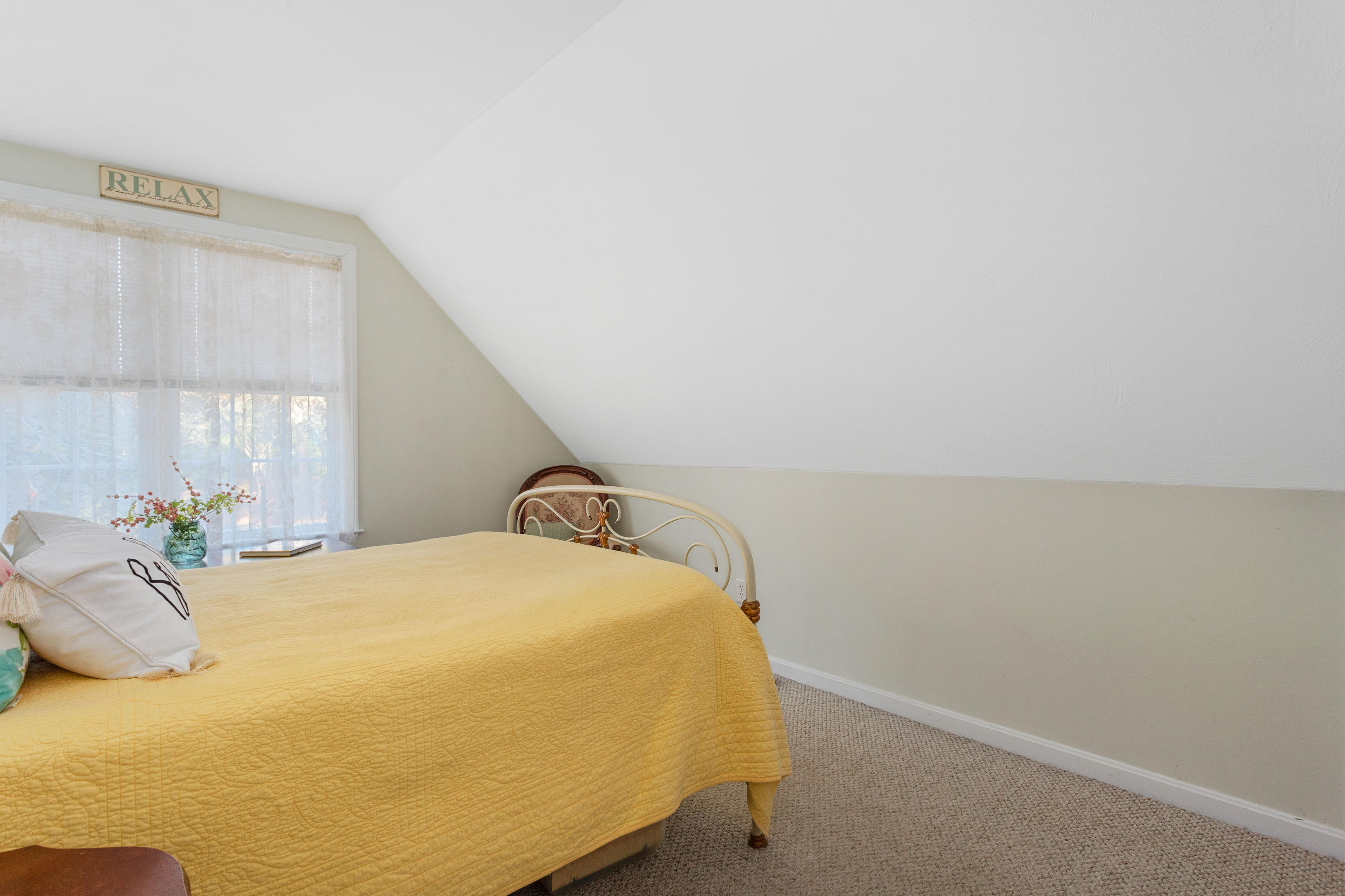 70 South Precinct Road Centerville, MA 02632 - Photo 17 of 32 a bed sitting in a bedroom next to a window