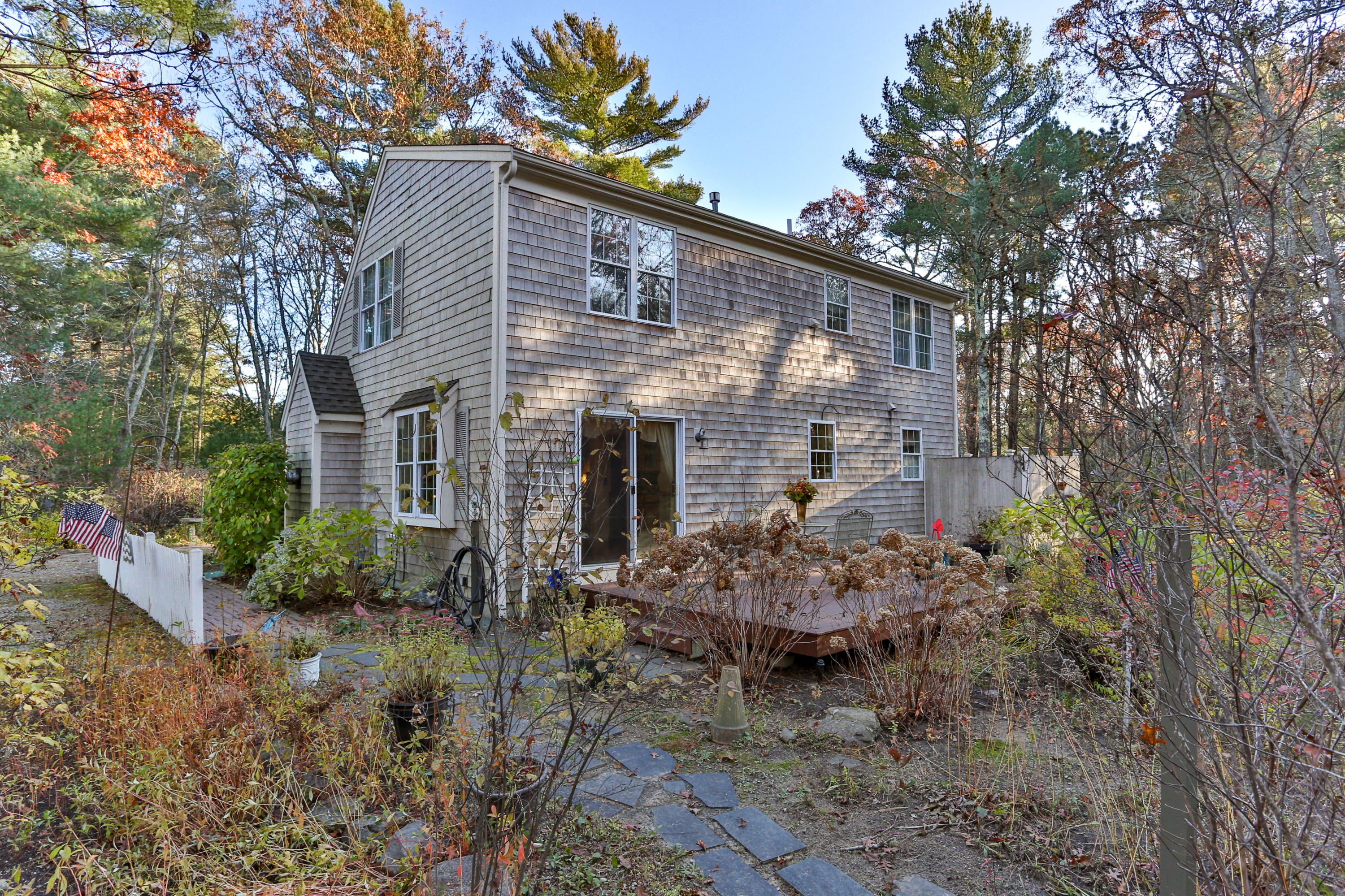 70 South Precinct Road Centerville, MA 02632 - Photo 24 of 32 a view of a house with a yard and chair