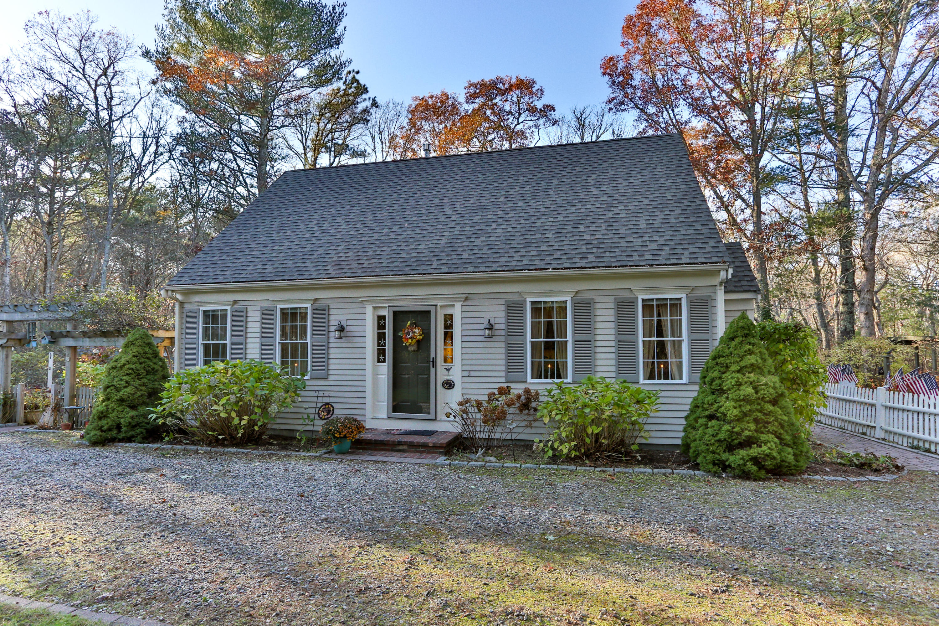 70 South Precinct Road Centerville, MA 02632 - Photo 3 of 32 a front view of a house with garden