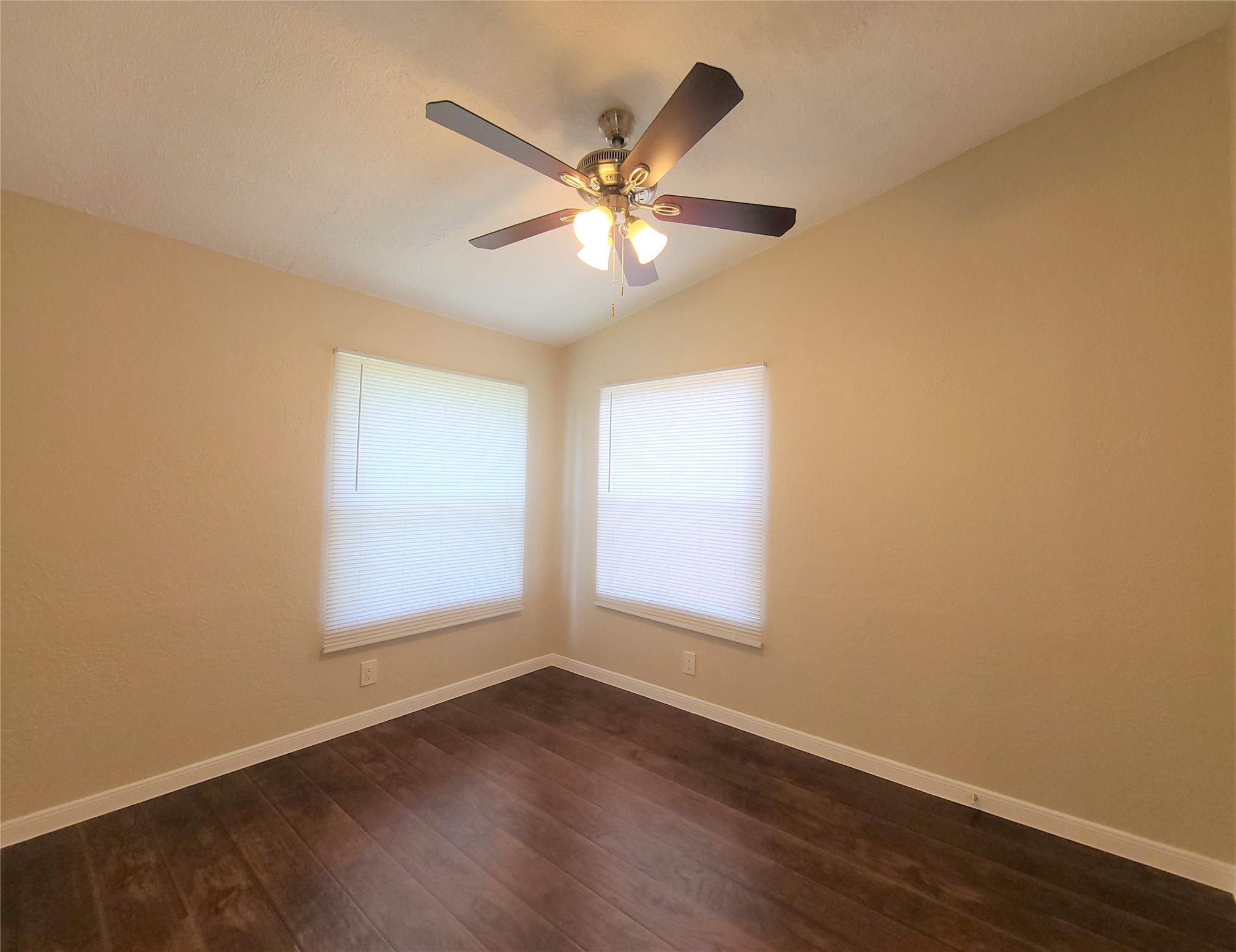 5414 Five Oaks Drive Spring, TX 77389 - Photo 11 of 13 a view of a livingroom with a ceiling fan and wooden floor