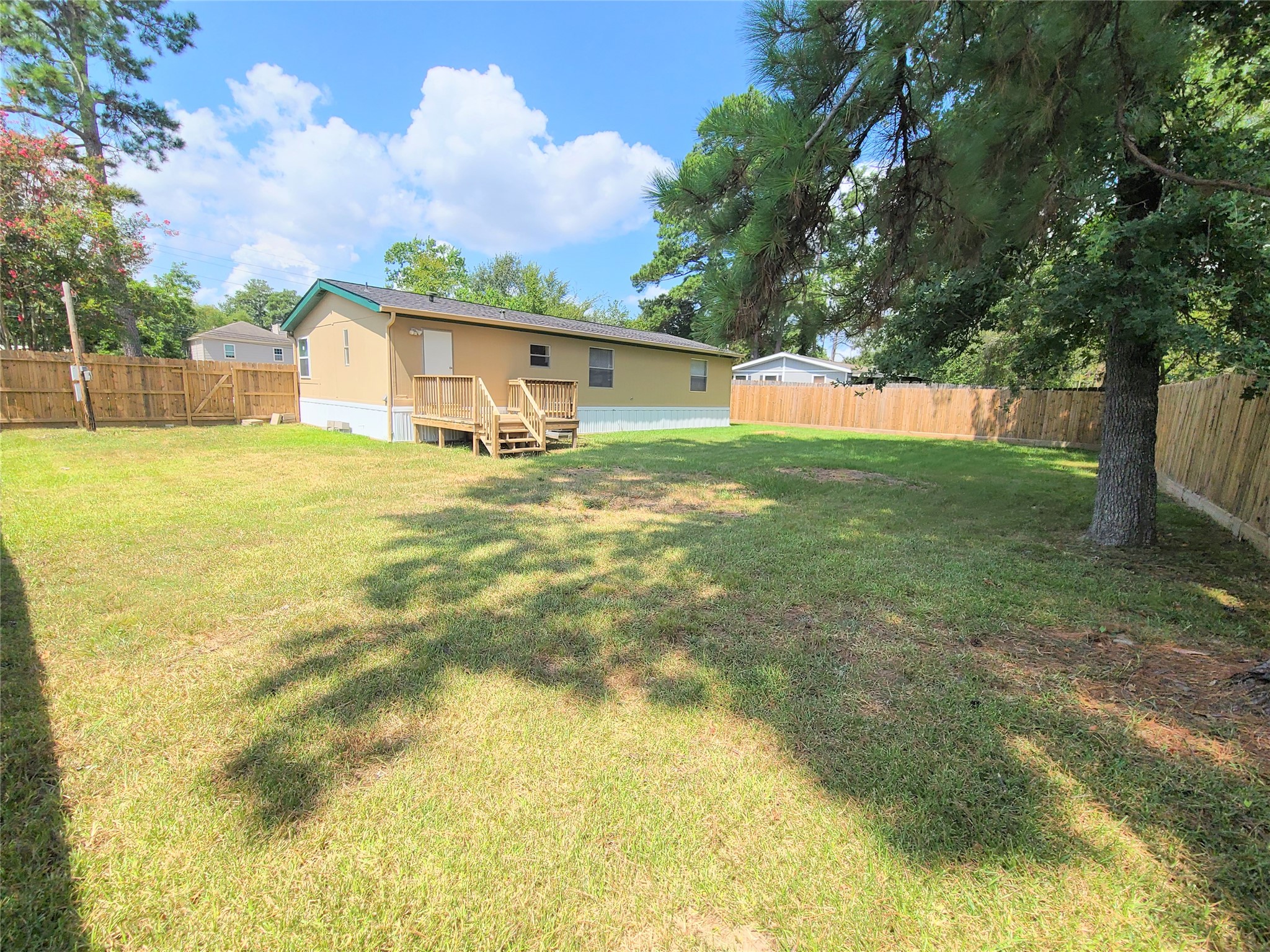 5414 Five Oaks Drive Spring, TX 77389 - Photo 12 of 13 a view of a backyard with large trees