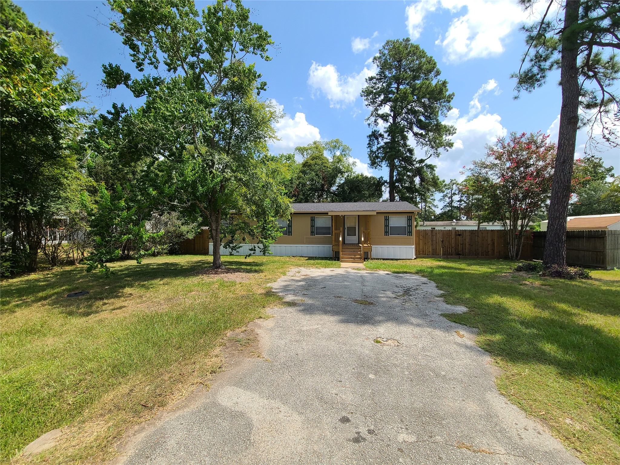 5414 Five Oaks Drive Spring, TX 77389 - Photo 2 of 13 a view of a house with backyard and a tree