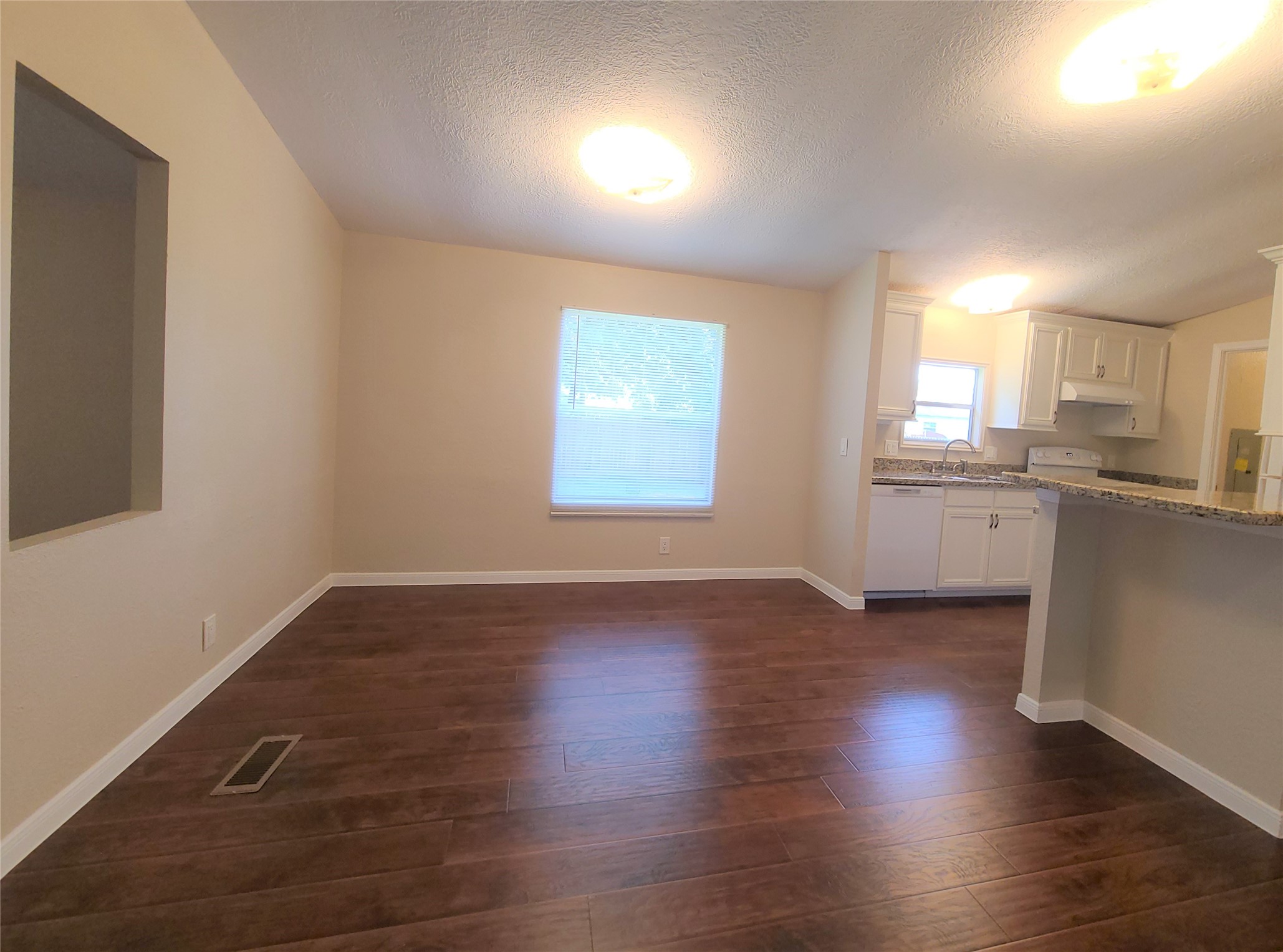 5414 Five Oaks Drive Spring, TX 77389 - Photo 5 of 13 an empty room with wooden floor and windows
