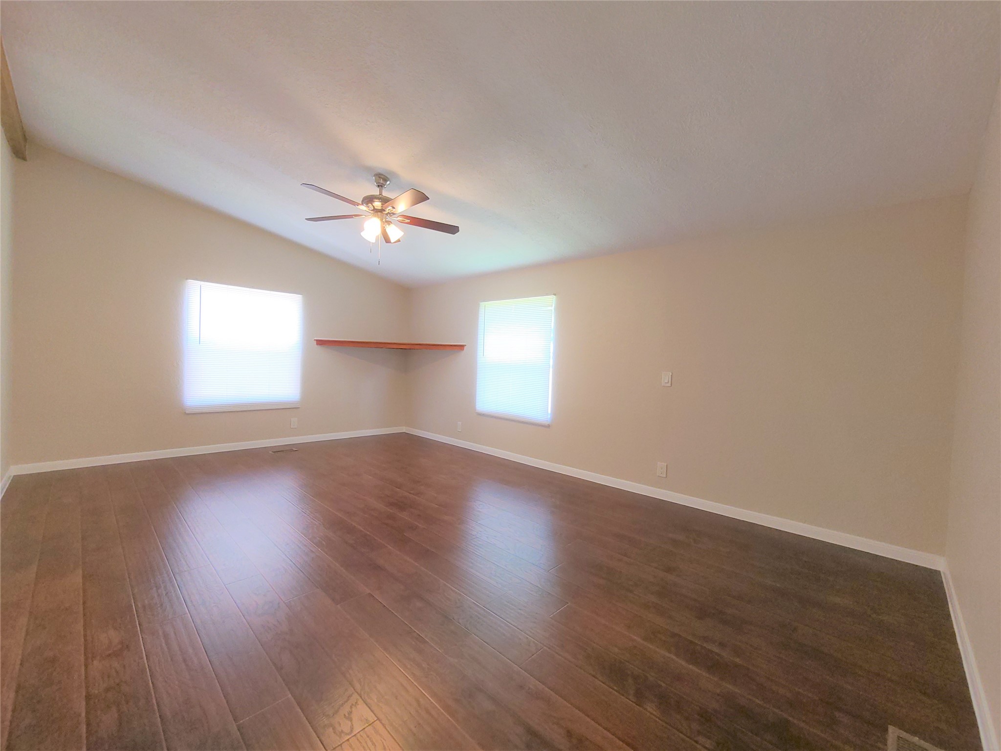 5414 Five Oaks Drive Spring, TX 77389 - Photo 8 of 13 a view of an empty room with wooden floor and a window