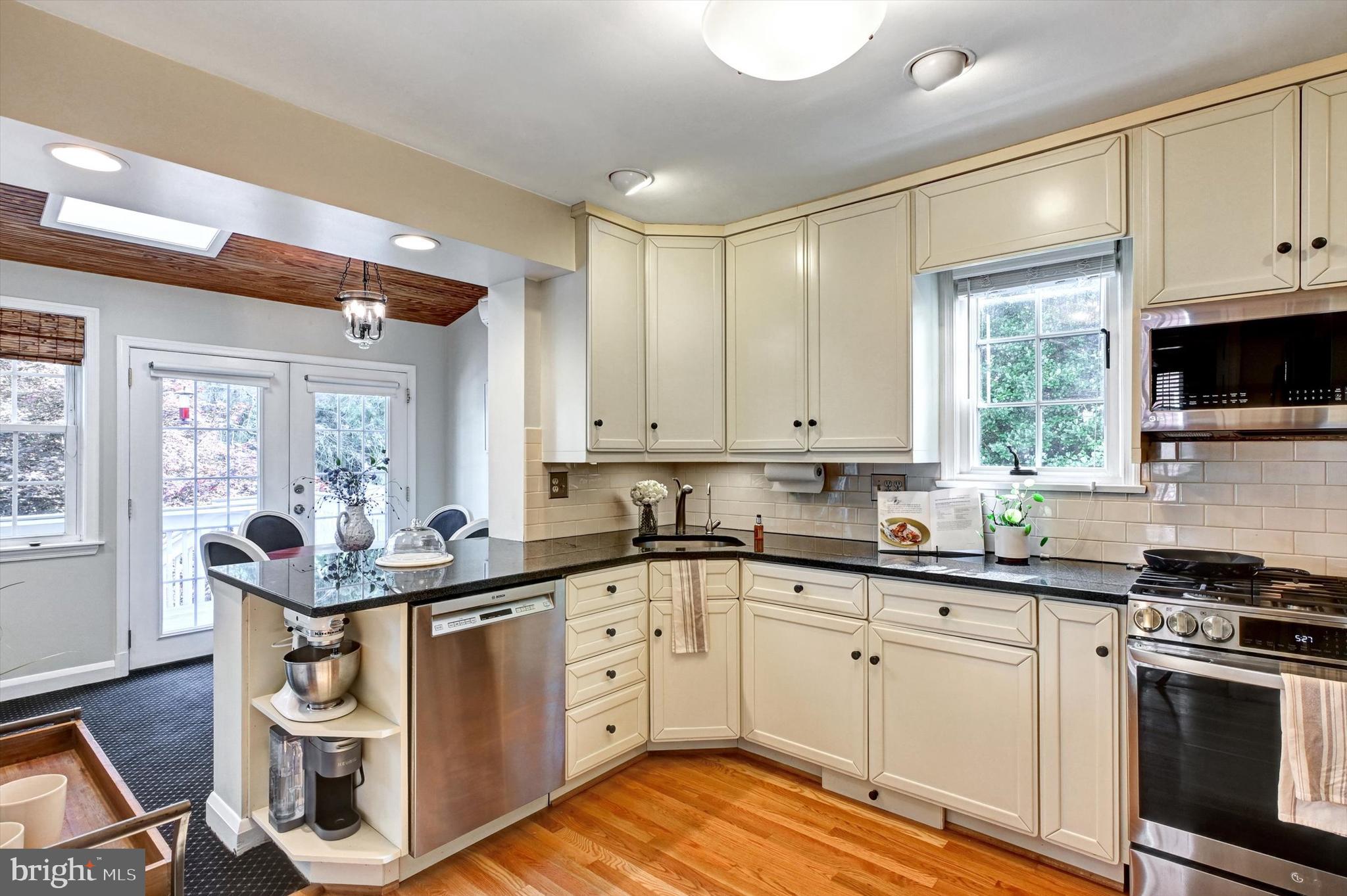 605 Worcester Road Towson, MD 21286 - Photo 11 of 39 a kitchen with a sink stove and cabinets