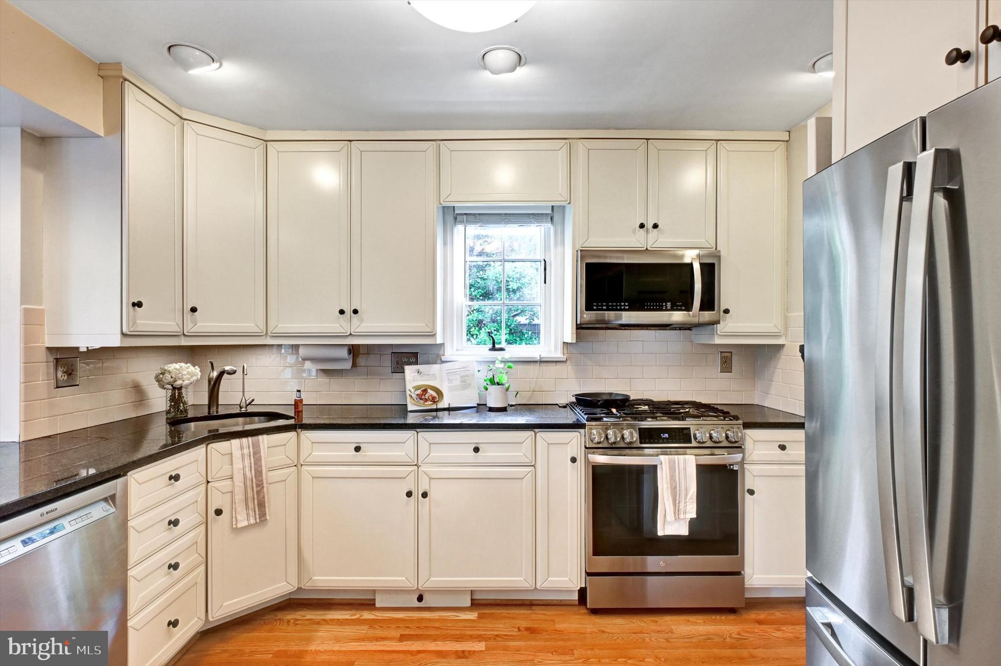 605 Worcester Road Towson, MD 21286 - Photo 12 of 39 a kitchen with granite countertop a sink stainless steel appliances and cabinets