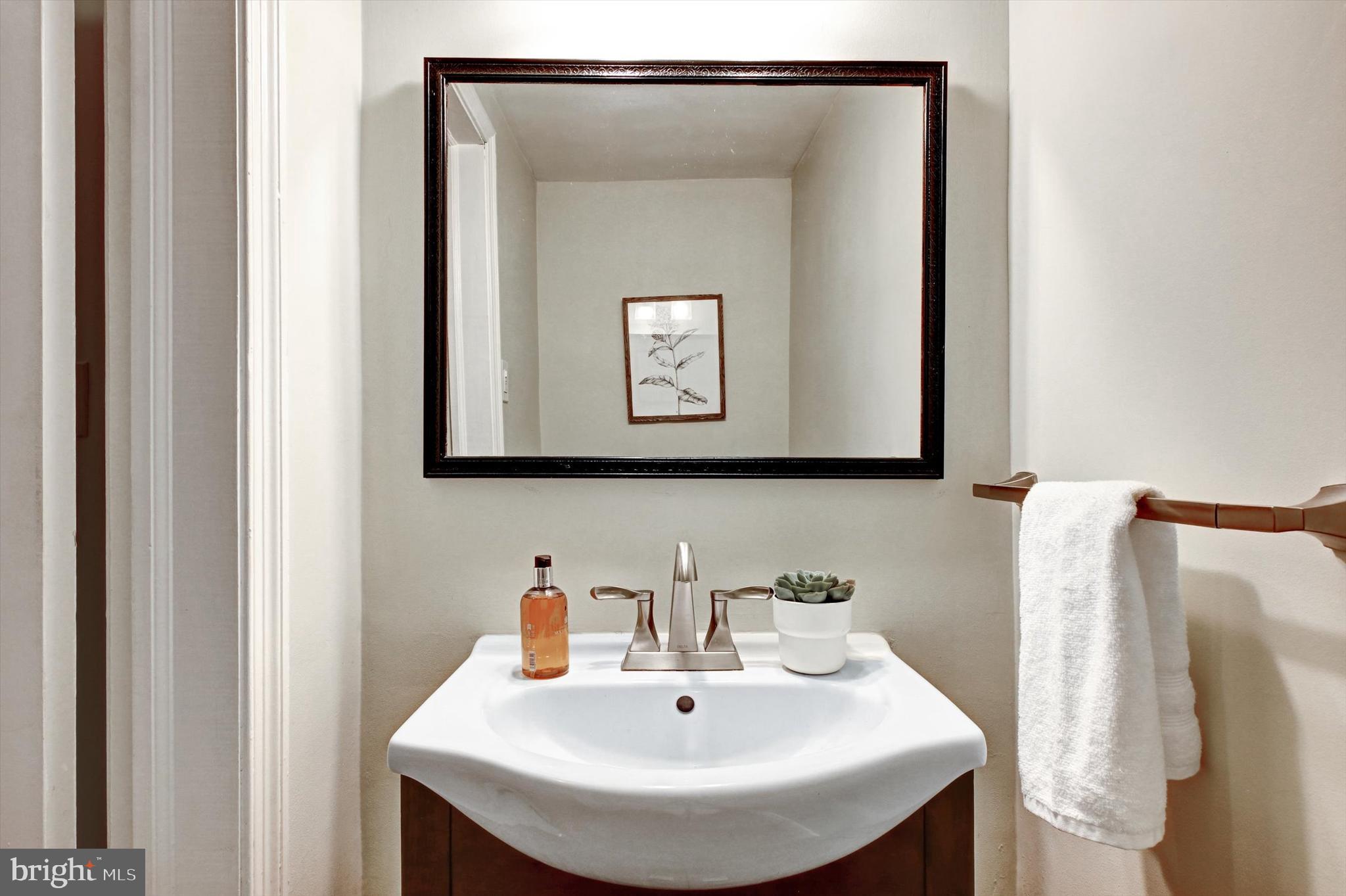 605 Worcester Road Towson, MD 21286 - Photo 15 of 39 a bathroom with a sink and a mirror