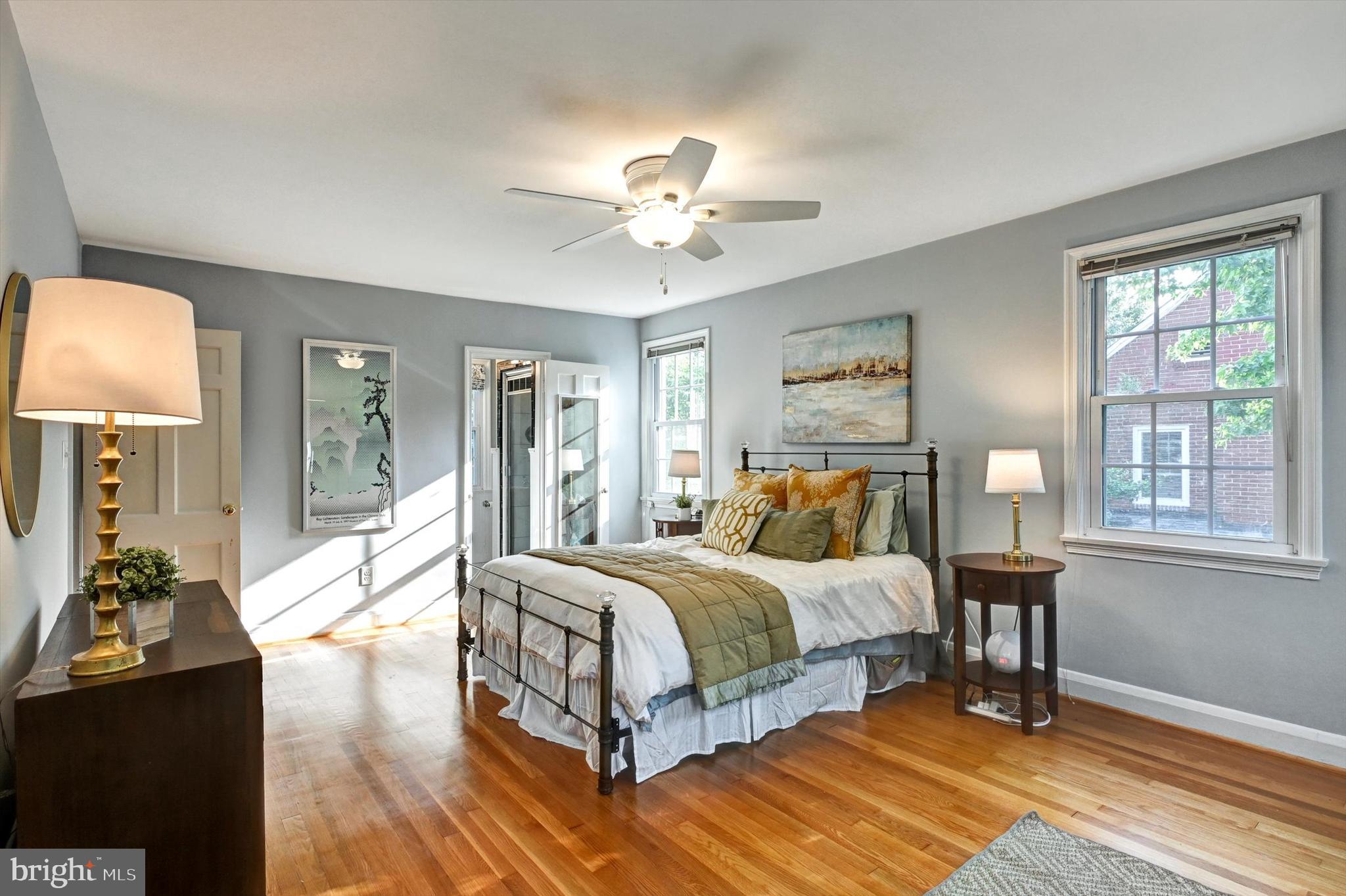 605 Worcester Road Towson, MD 21286 - Photo 19 of 39 a bed room with a bed and a chandelier