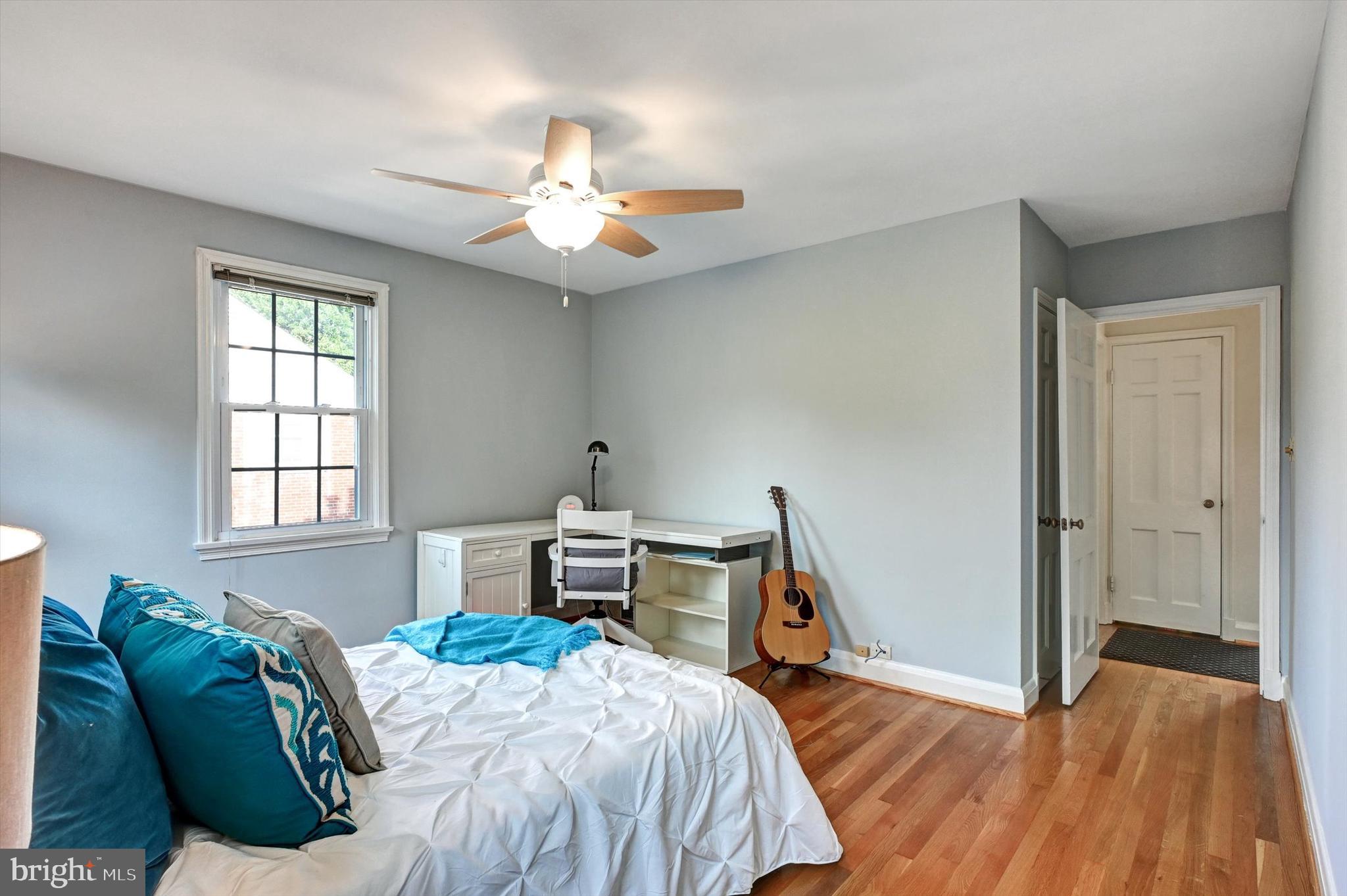 605 Worcester Road Towson, MD 21286 - Photo 24 of 39 a bedroom with a bed and a chandelier