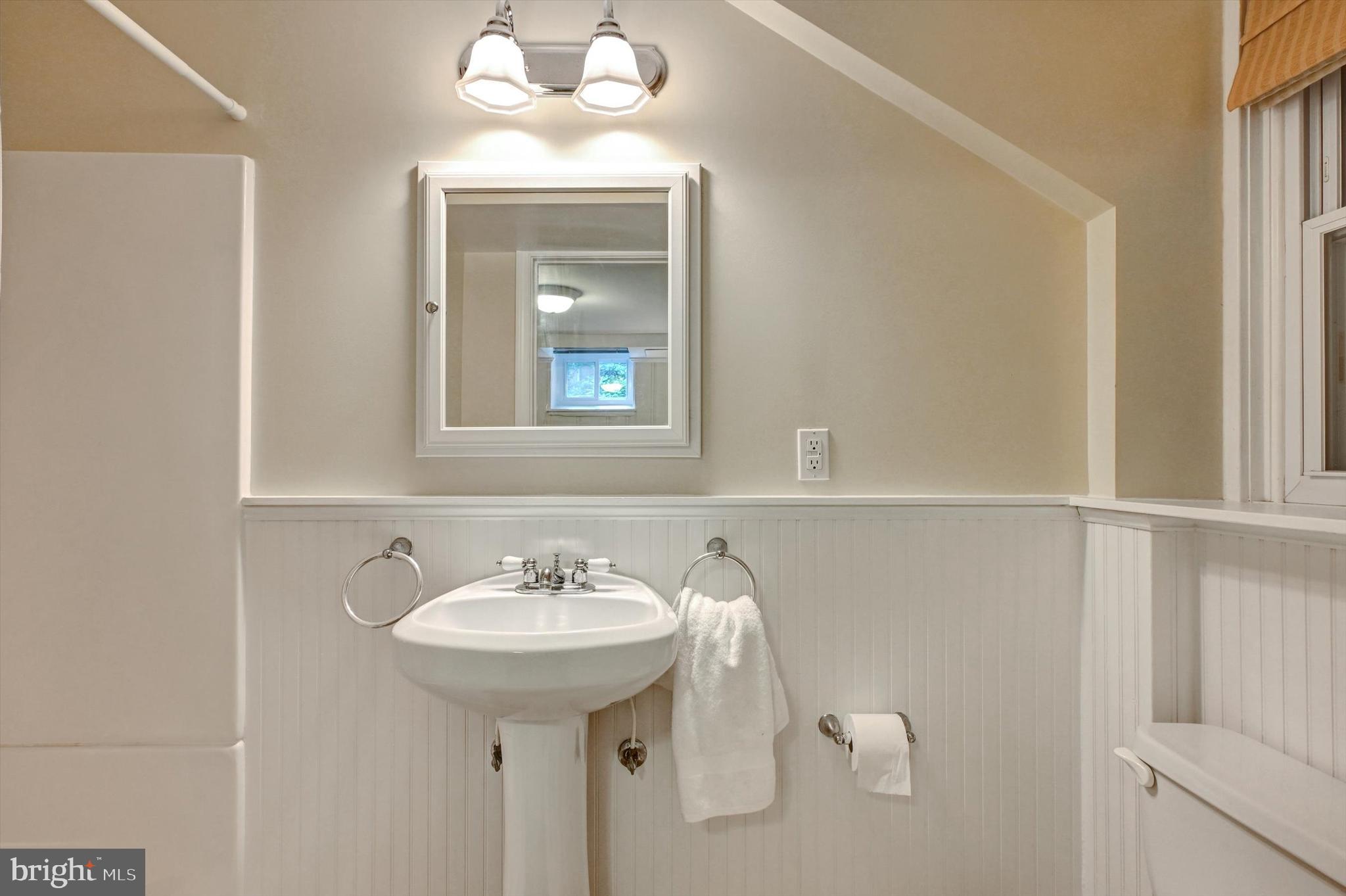 605 Worcester Road Towson, MD 21286 - Photo 30 of 39 a bathroom with a sink and a mirror