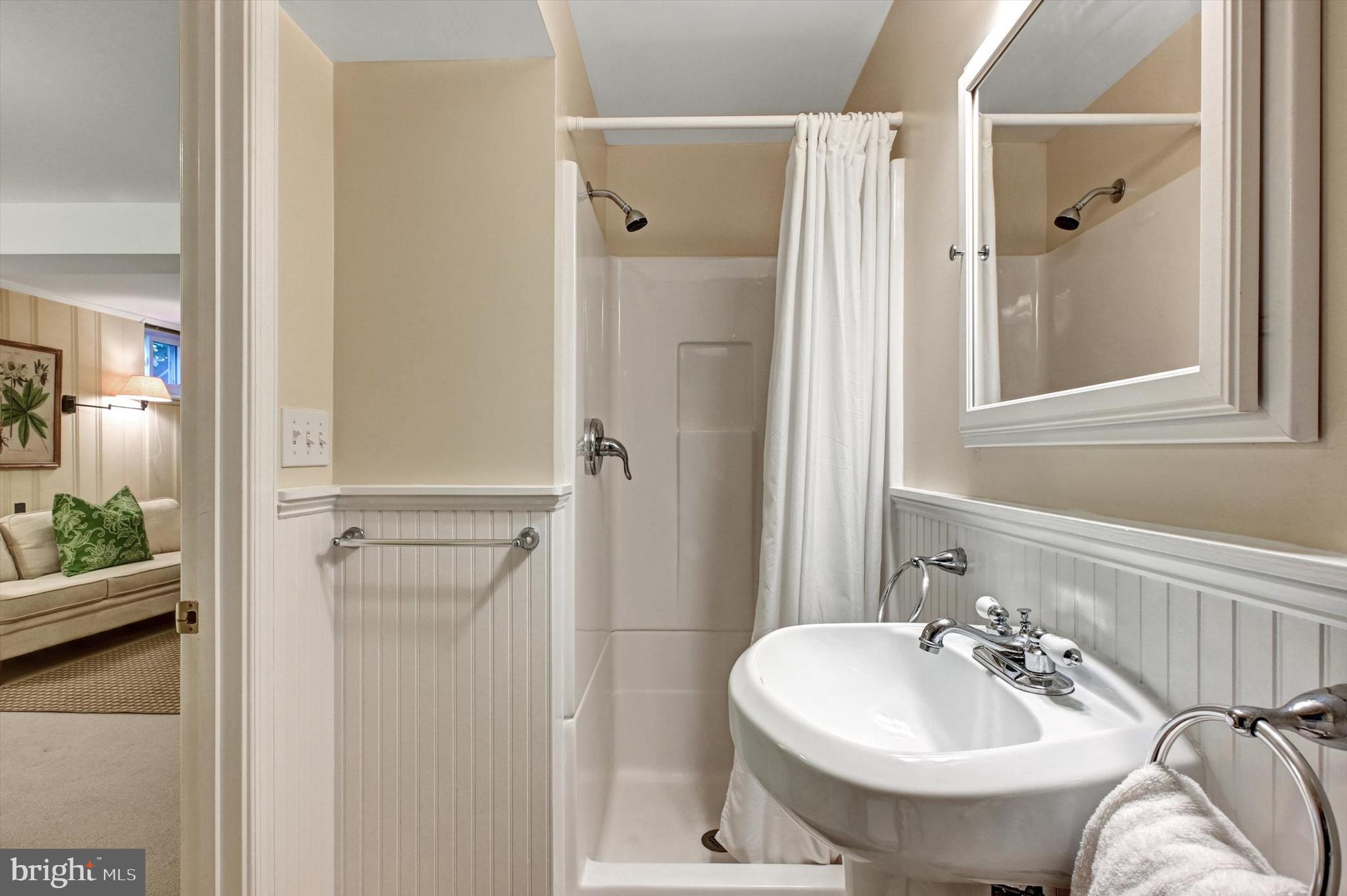 605 Worcester Road Towson, MD 21286 - Photo 31 of 39 a bathroom with a sink a toilet and shower