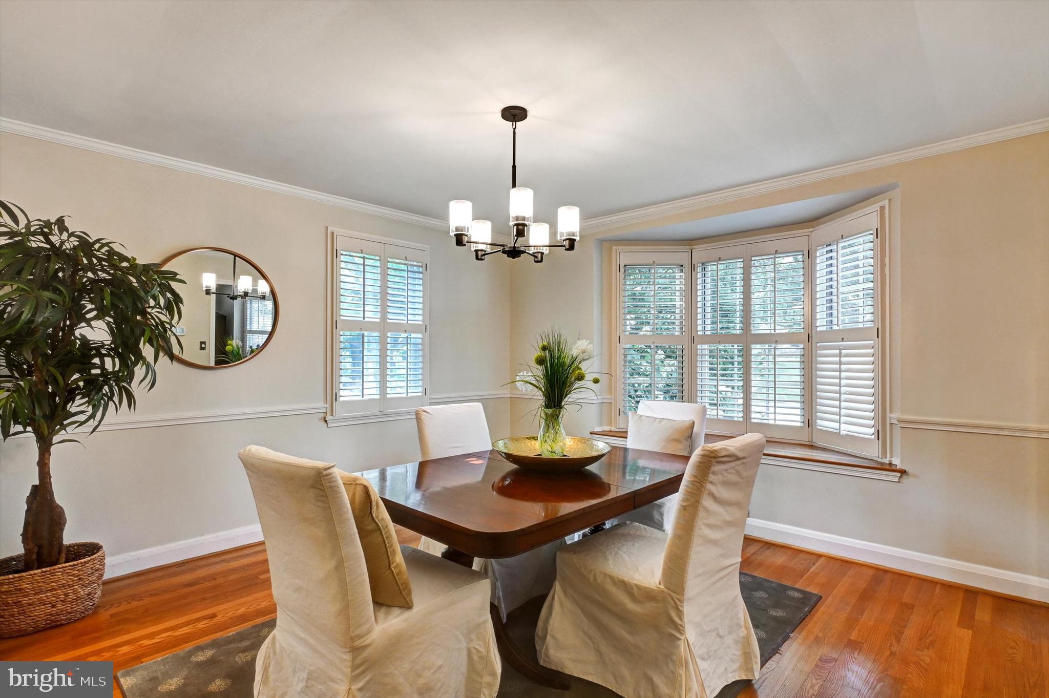 605 Worcester Road Towson, MD 21286 - Photo 9 of 39 a dining room with furniture a chandelier and wooden floor
