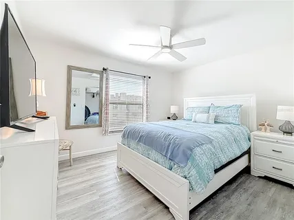 a bedroom with a bed and a closet