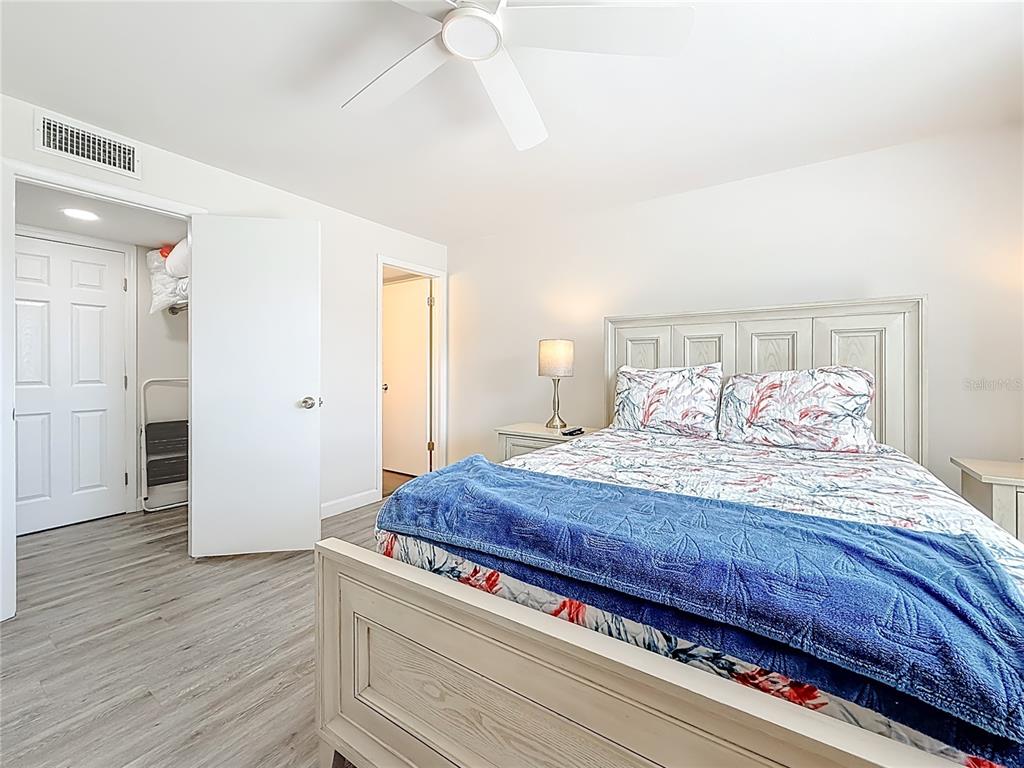 19725 Gulf Boulevard, Unit 46 Indian Rocks Beach, FL 33785 - Photo 27 of 55 a bedroom with bed and wooden floor