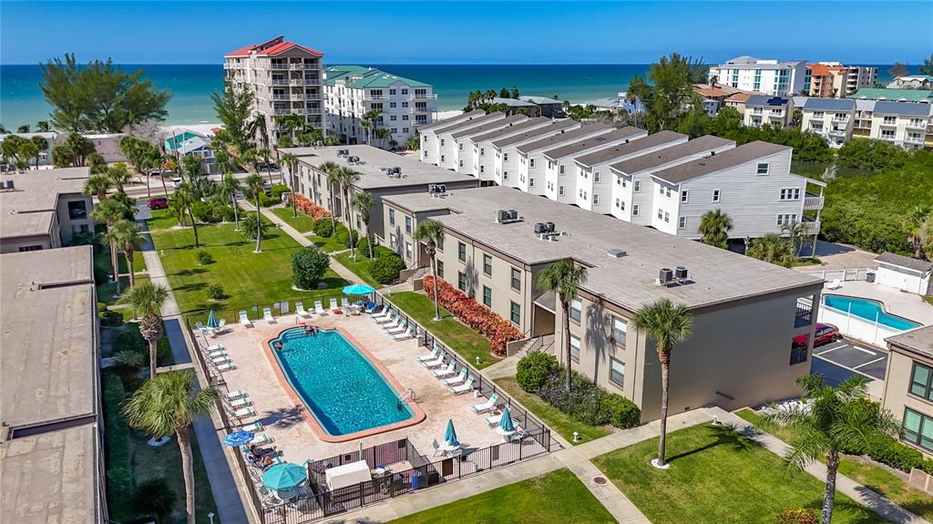 19725 Gulf Boulevard, Unit 46 Indian Rocks Beach, FL 33785 - Photo 3 of 55 an aerial view of multiple houses with a yard