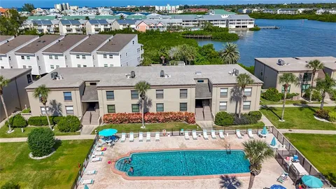 an aerial view of multiple houses with yard