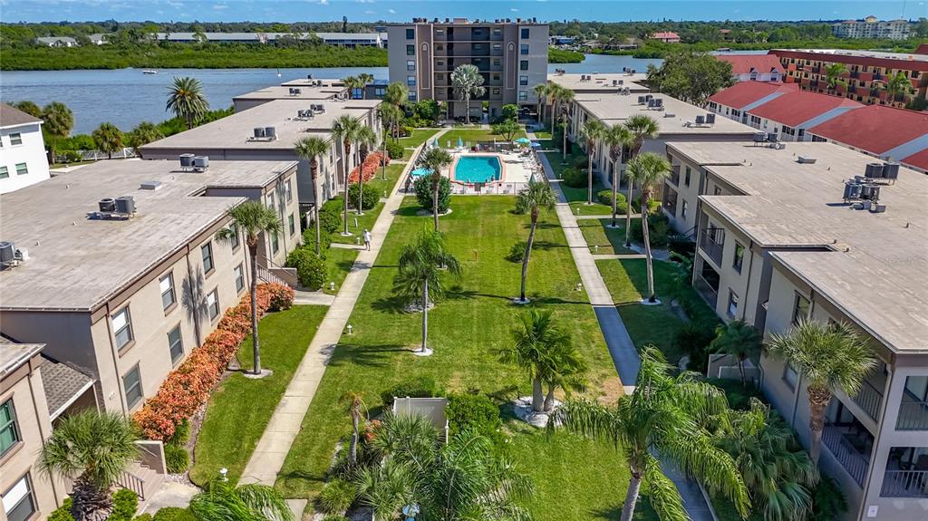 19725 Gulf Boulevard, Unit 46 Indian Rocks Beach, FL 33785 - Photo 42 of 55 an aerial view of multiple houses with yard