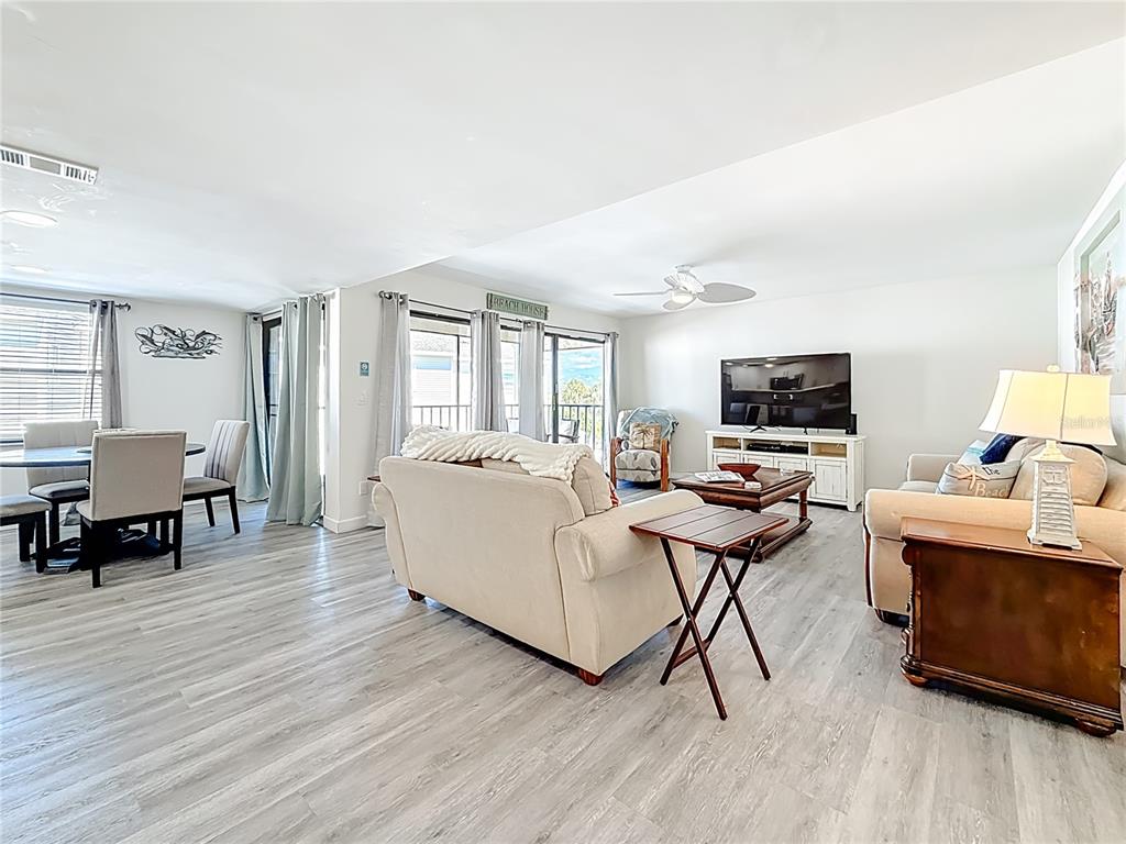 19725 Gulf Boulevard, Unit 46 Indian Rocks Beach, FL 33785 - Photo 6 of 55 a living room with furniture and a flat screen tv