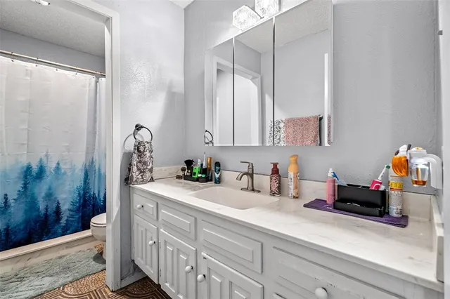 a kitchen with sink cabinets and window