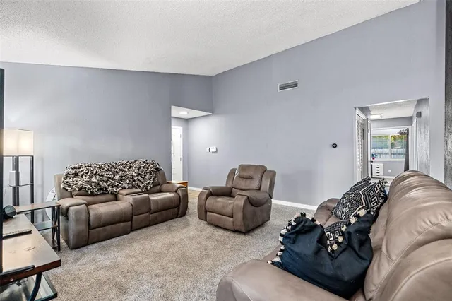 a living room with furniture window and a lamp