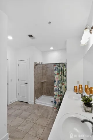 a bathroom with a sink and mirror