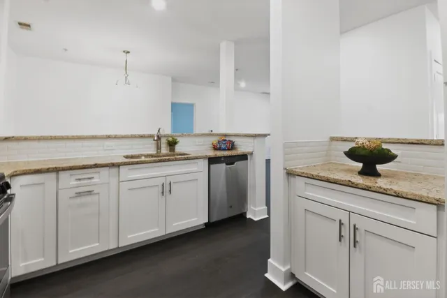 a kitchen with a sink and cabinets