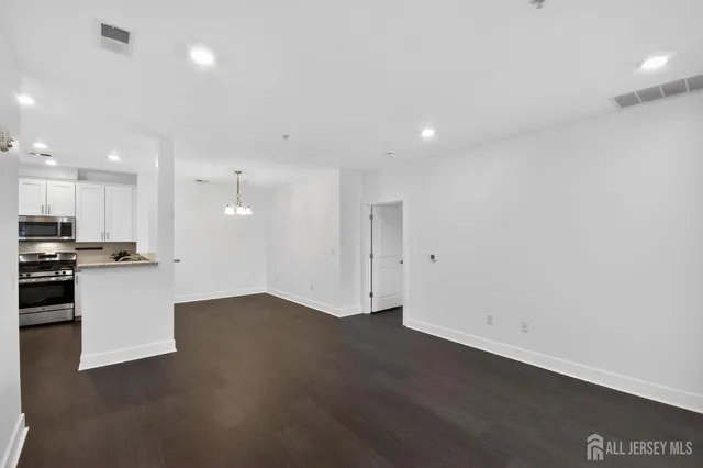 a view of kitchen with wooden floor