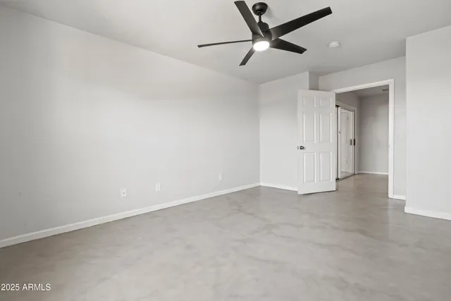 a bathroom with a double vanity sink a toilet and shower