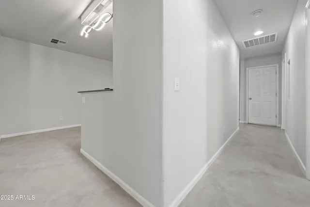 a view of a patio with a table and chairs