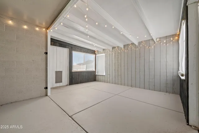 a large building with a large parking space in front of it